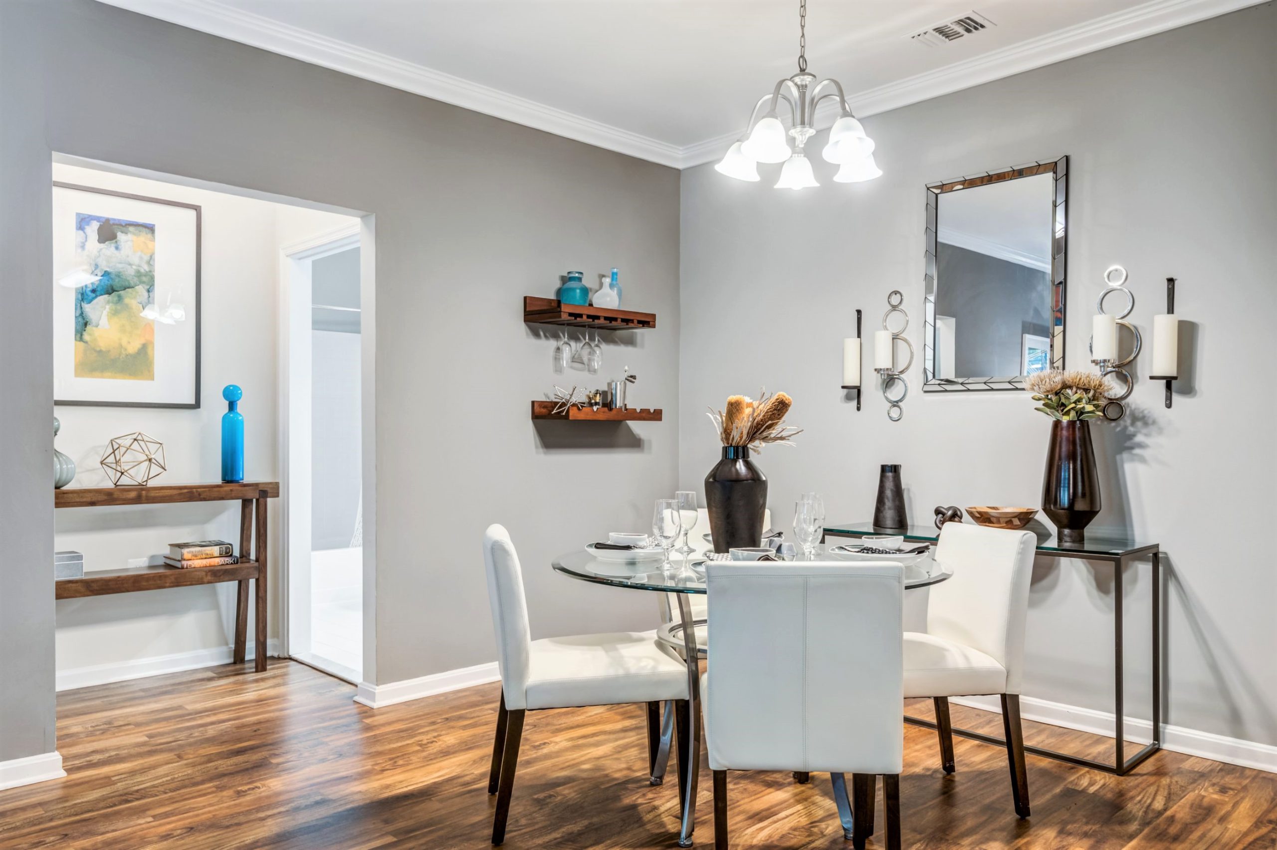 Dining space with table, chairs, and decorative wall art at jefferson arbors at broadlands luxury apartments in ashburn va